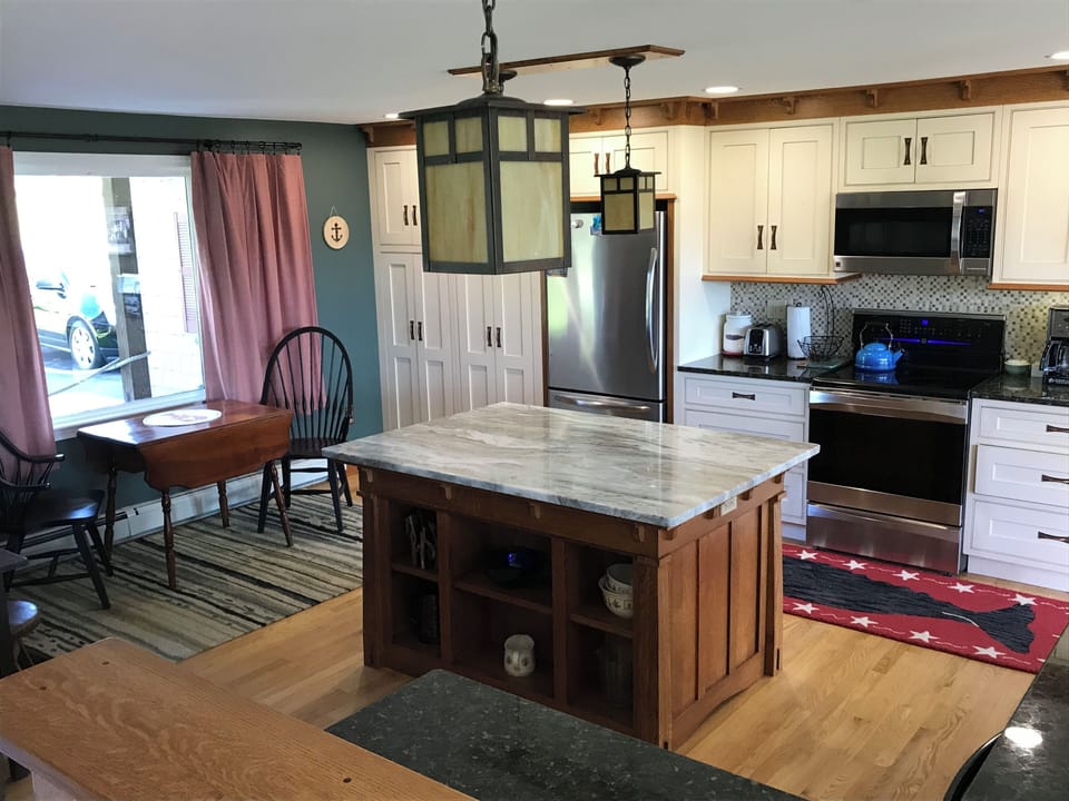 Large, modern kitchen with plenty of counter space for a home cooked meal.