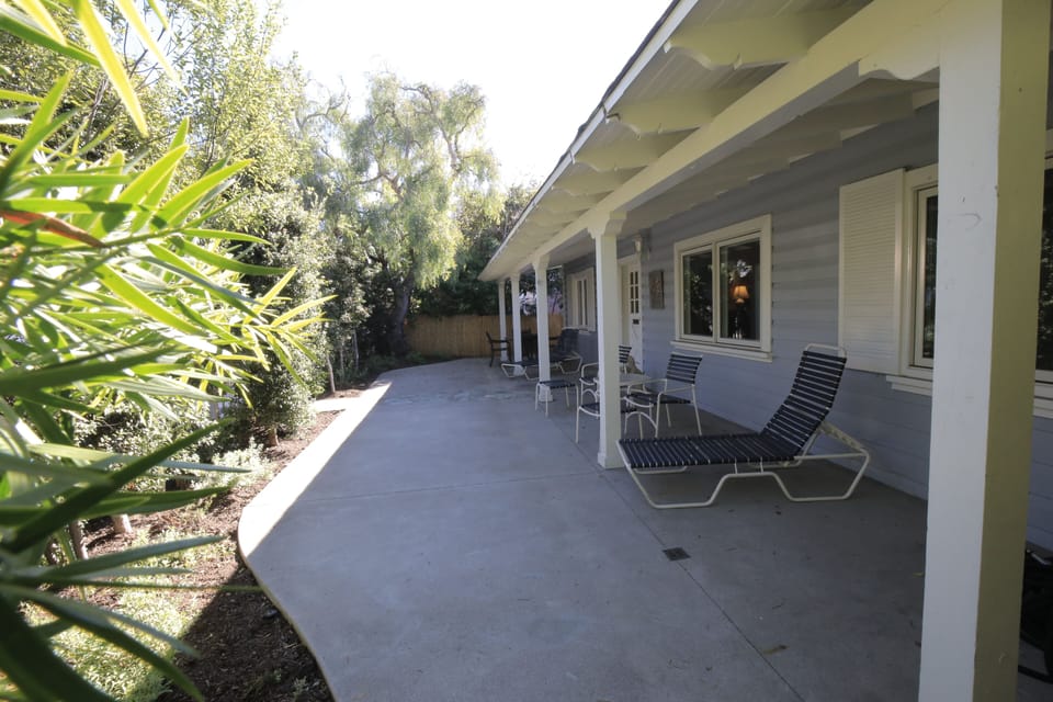 large fenced in private patio at front of house. Kids can play and entertainment