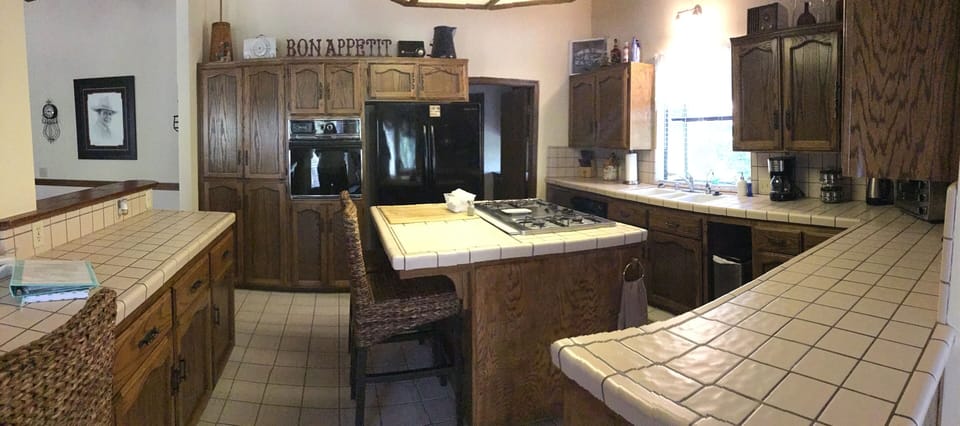 Kitchen with built ins a french door refrigerator with ice maker
