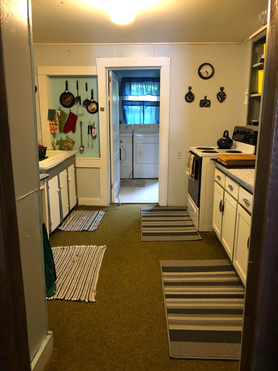 Kitchen off of dining room Electric Stove, oven, crock pot, blender, pots 