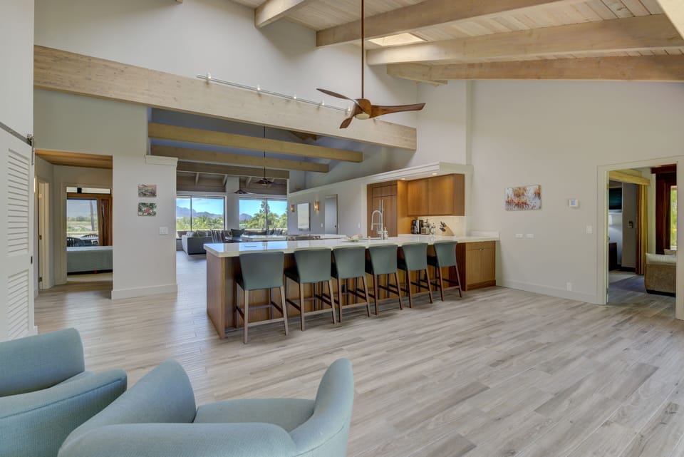 Kitchen and bar with view towards great room