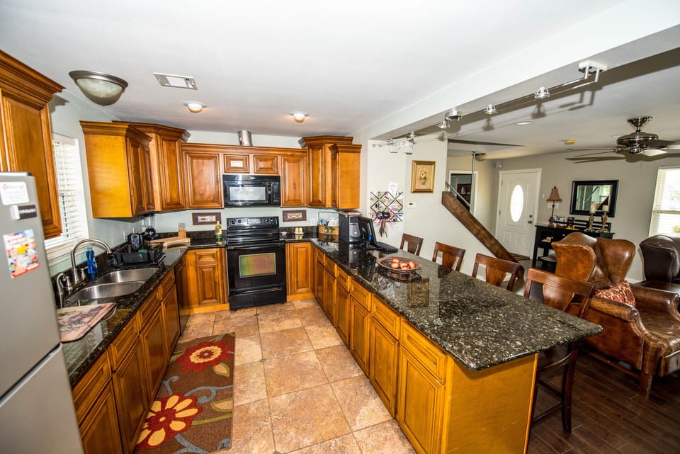 Spacious kitchen; granite tops; hardwood maple cabinets.