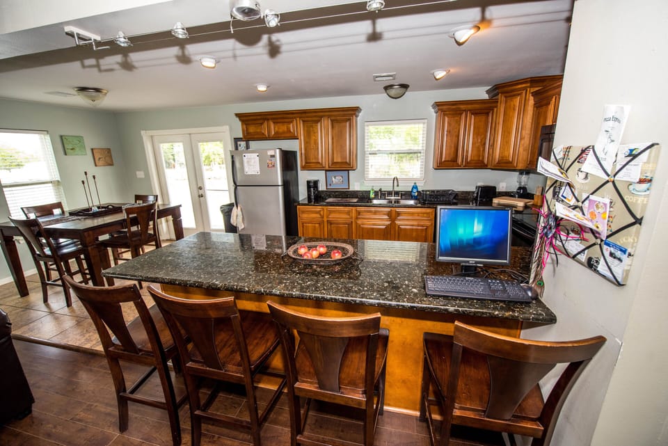 Open floor plan between kitchen, dining, and living room.