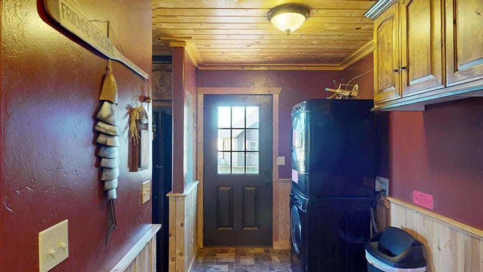There is a stacked washer and dryer access to the back deck.