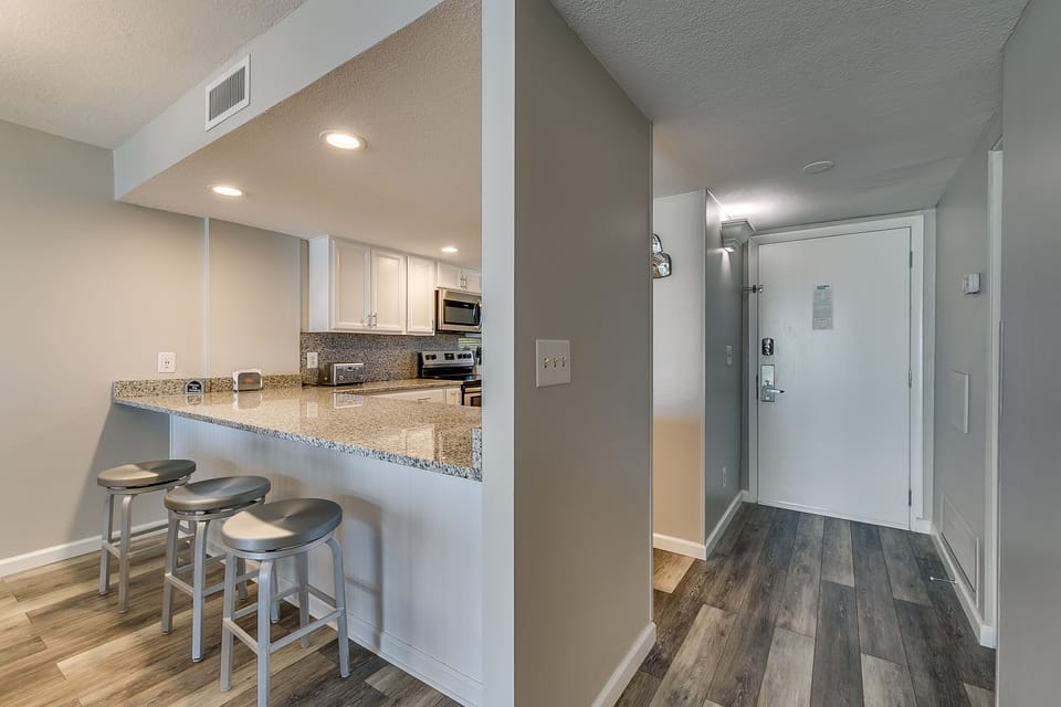 Kitchen has an eat in bar