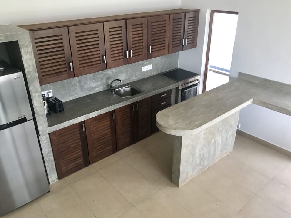 Full kitchen with fridge, freezer, oven, hob, microwave, kettle and toaster