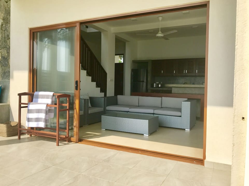 Sliding doors facilitate flexible indoor-outdoor living area