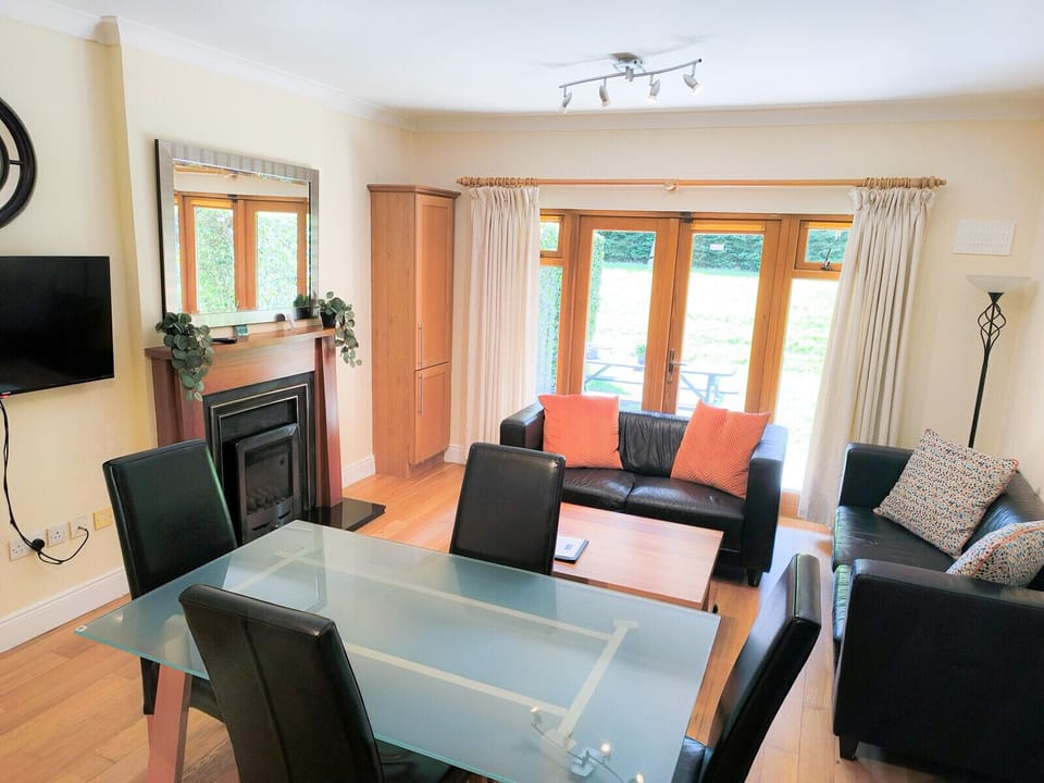 Heyward Mews Holiday Homes,. Open plan dining area, bright, large windows, comfortable seating.