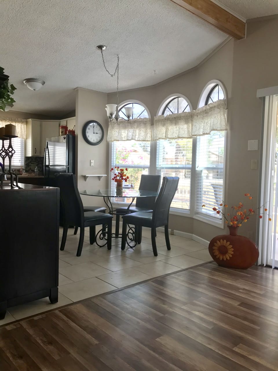 Comfortable seating for four and a view of the golf course from the dining room
