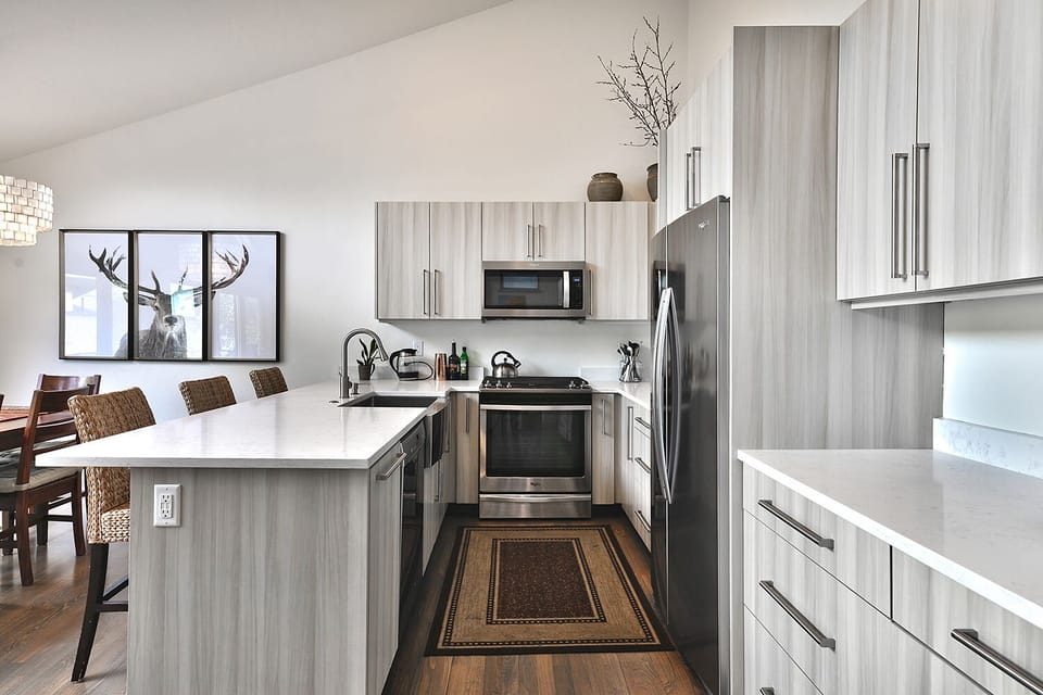 Kitchen w /dining island. 