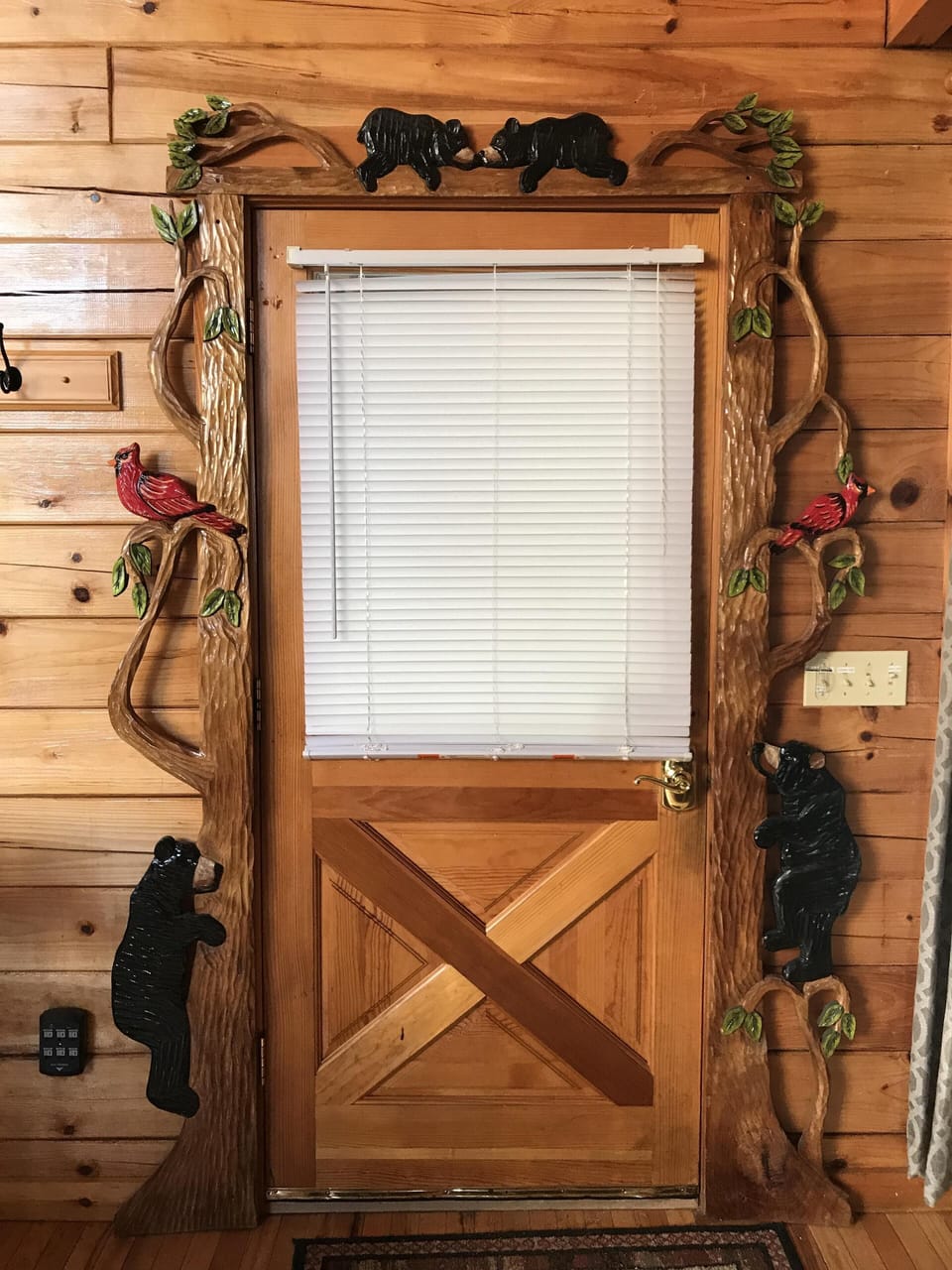 Carving around front porch door 