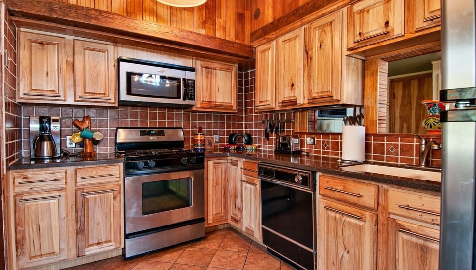 Updated cabinets with Corian countertops