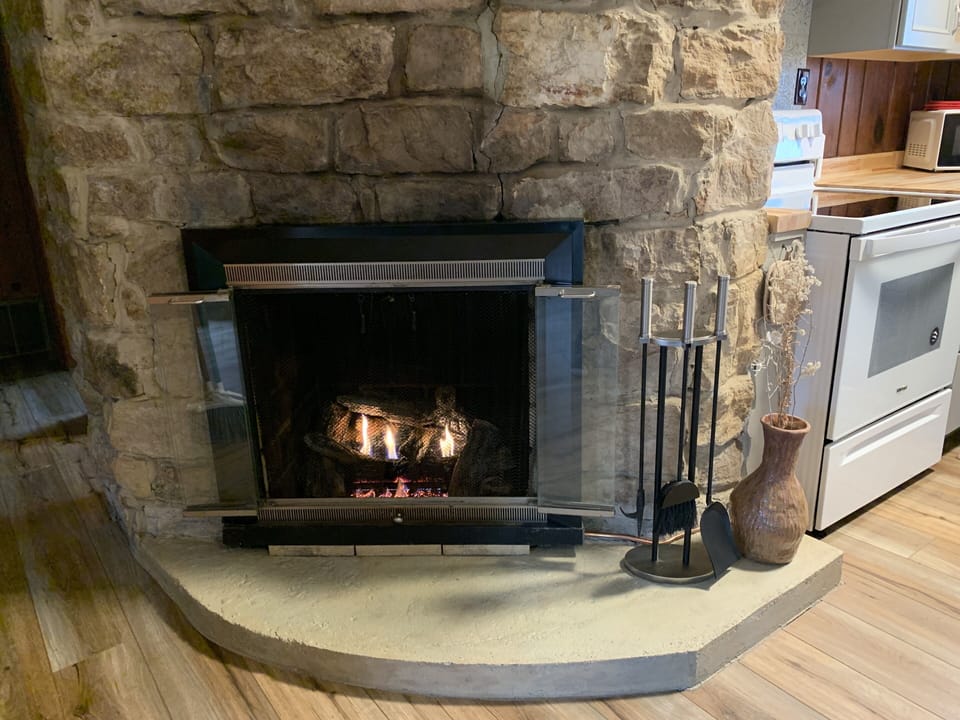 large stone gas fireplace for romantic / cozy evenings