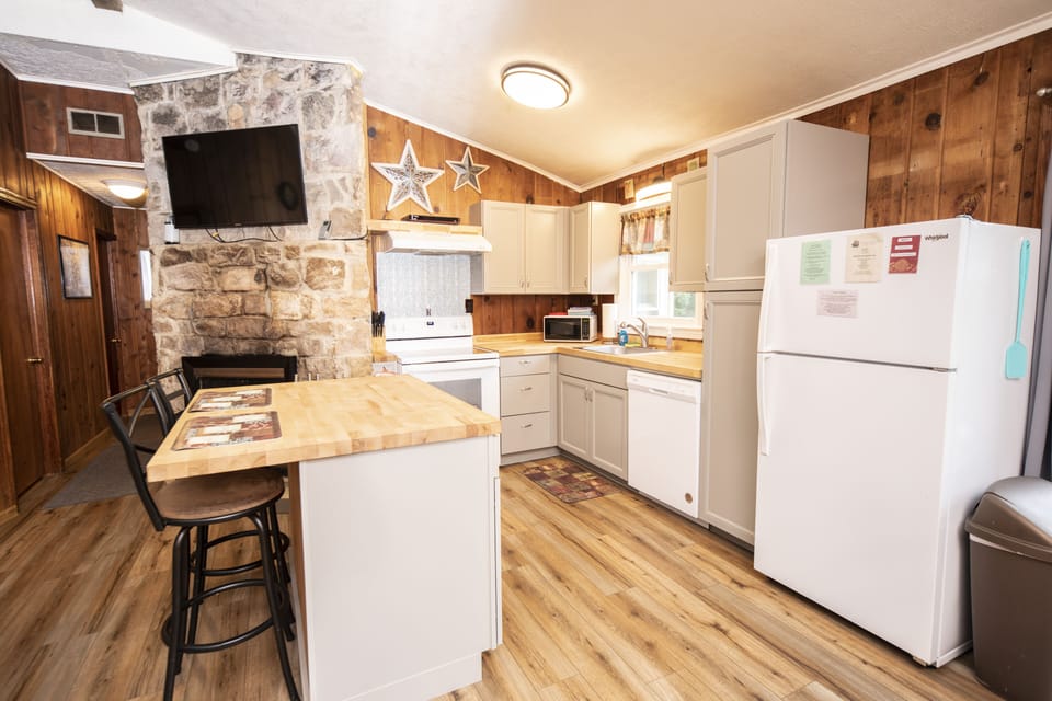 fully equipped kitchen with large island for extra counter space and seating