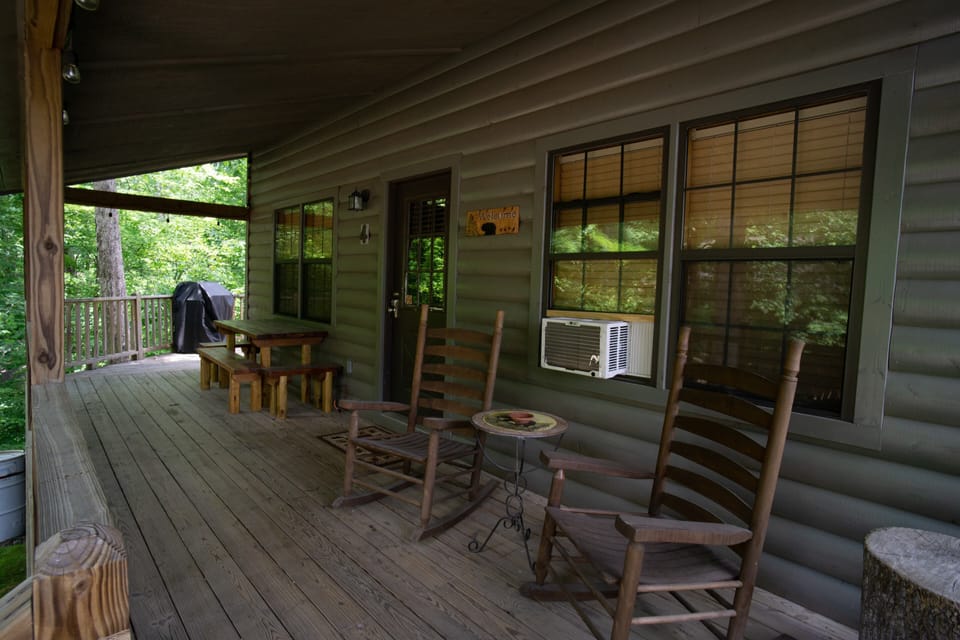 Rocking chairs and picnic table on deck.