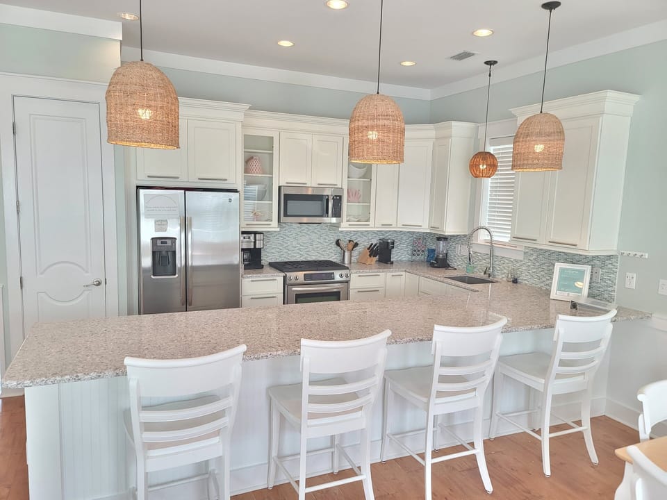 Large gourmet kitchen, fully stocked to cook for the family. Huge eat at counter