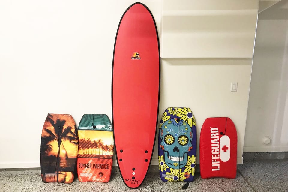 Bodyboards and a Surfboard