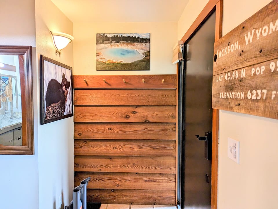 Entryway has storage for coats and boots