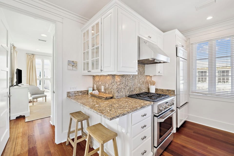 Your bright, fully-equipped kitchen features granite counters and stainless appliances, perfect for preparing home-cooked meals during your stay.