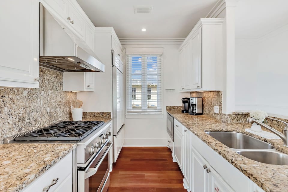 Your gourmet galley kitchen features granite countertops, stainless appliances, and everything you need to create memorable meals during your stay.