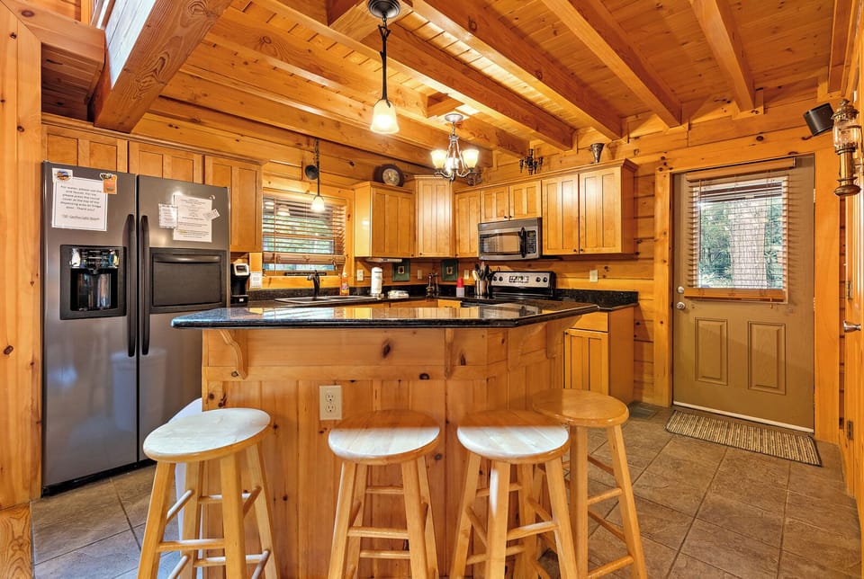 Kitchen with Granite Counters and Bar Seating