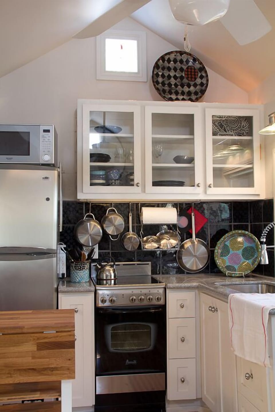 Well lighted kitchen. Custom cabinets,granite countertop, chopping block.