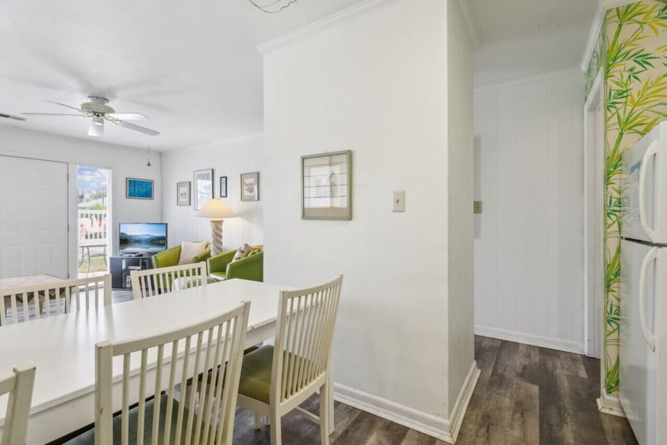 Leave the first bedroom to enter the living space! The kitchen, dining, and living room are all combined!