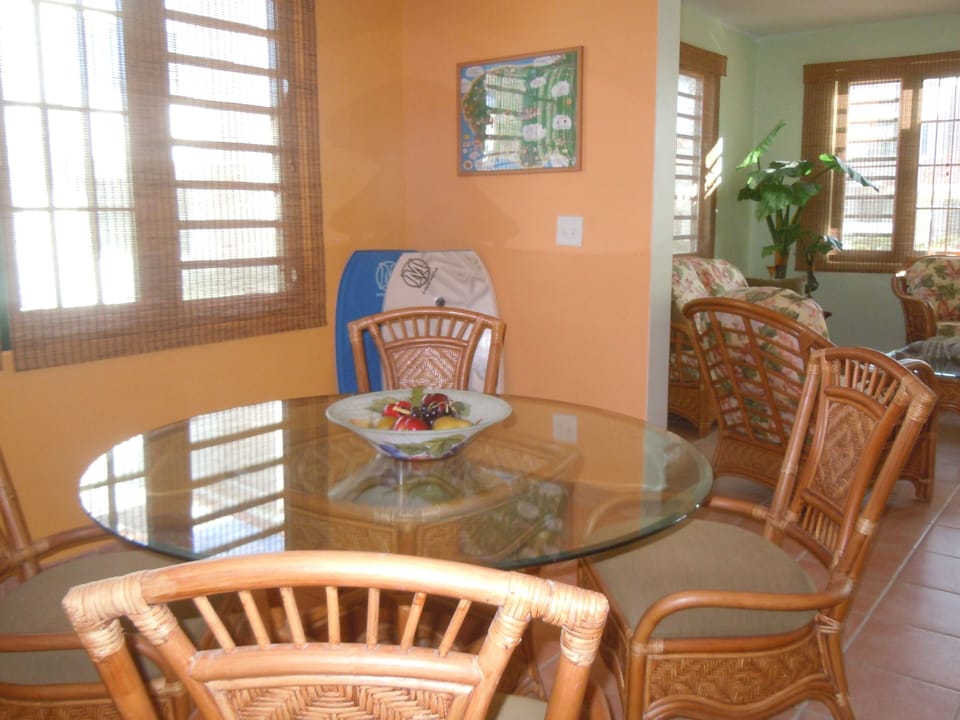 Bright and airy, with matching dining room and living room rattan furniture.