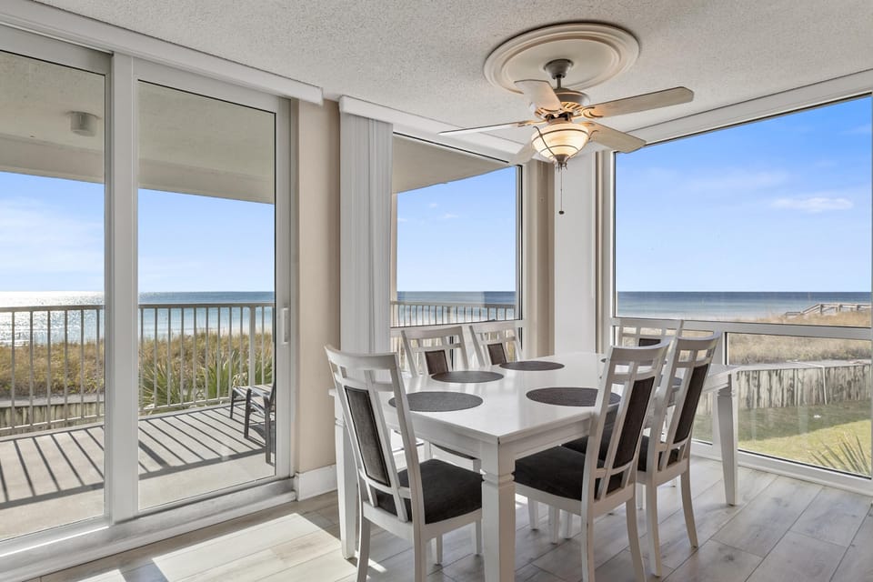 Dining with a View - Cozy dining space adjacent to the kitchen, featuring stunning beach and ocean views
