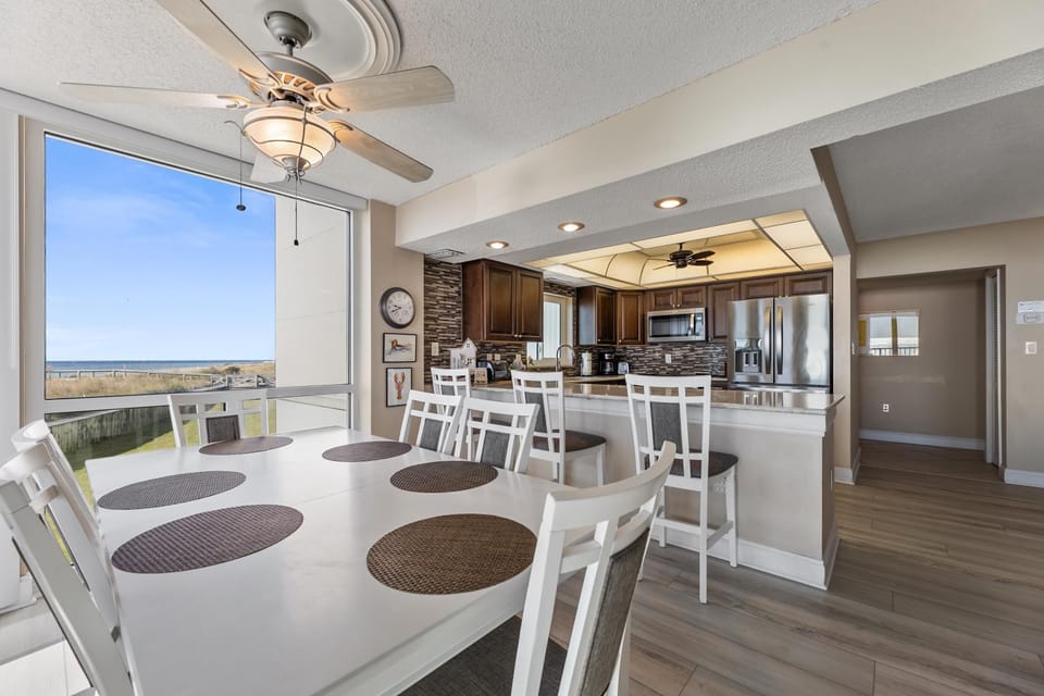 Dining Area - Bright dining spot with lovely views, perfectly situated beside the breakfast bar and open kitchen