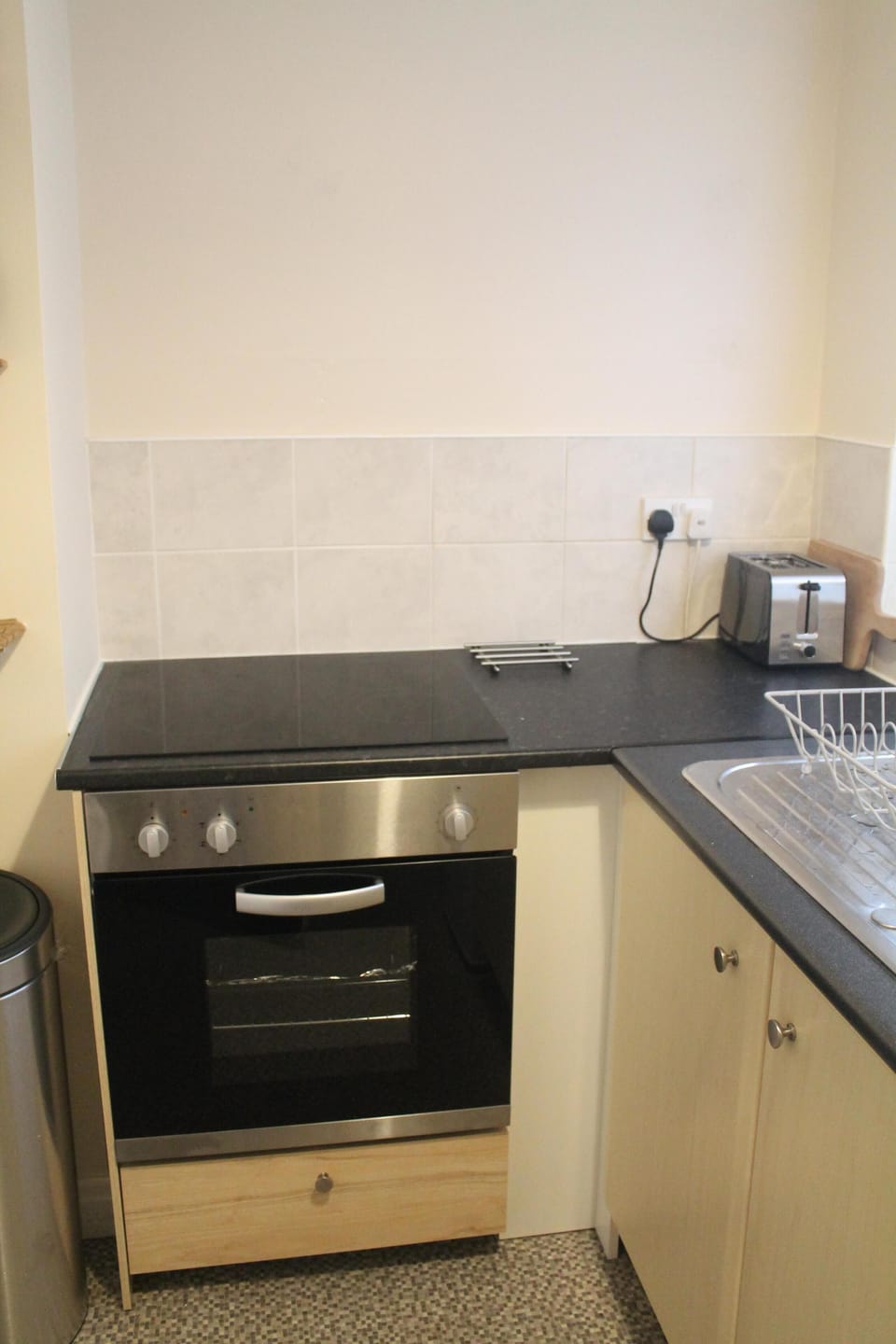 Modern kitchen with fan oven and ceramic hob.