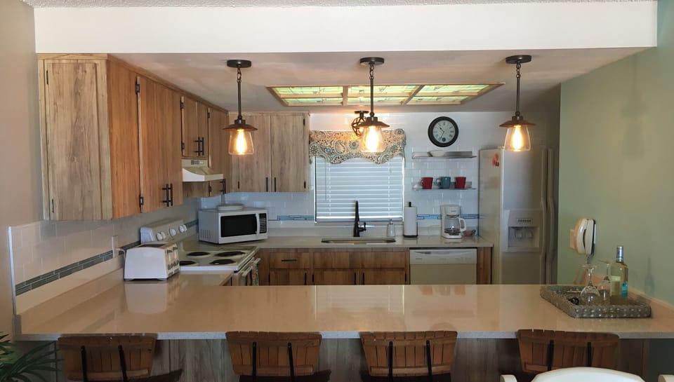 Kitchen with wine cooler, reg coffee pot and Keurig coffee pot and more. 