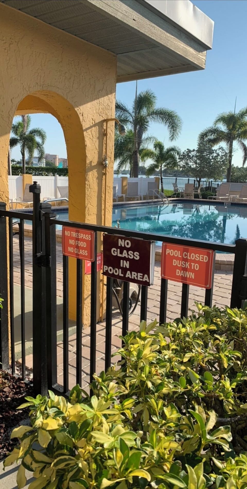 Outdoor shower for rinsing off sand from the beach and gate to pool area. 