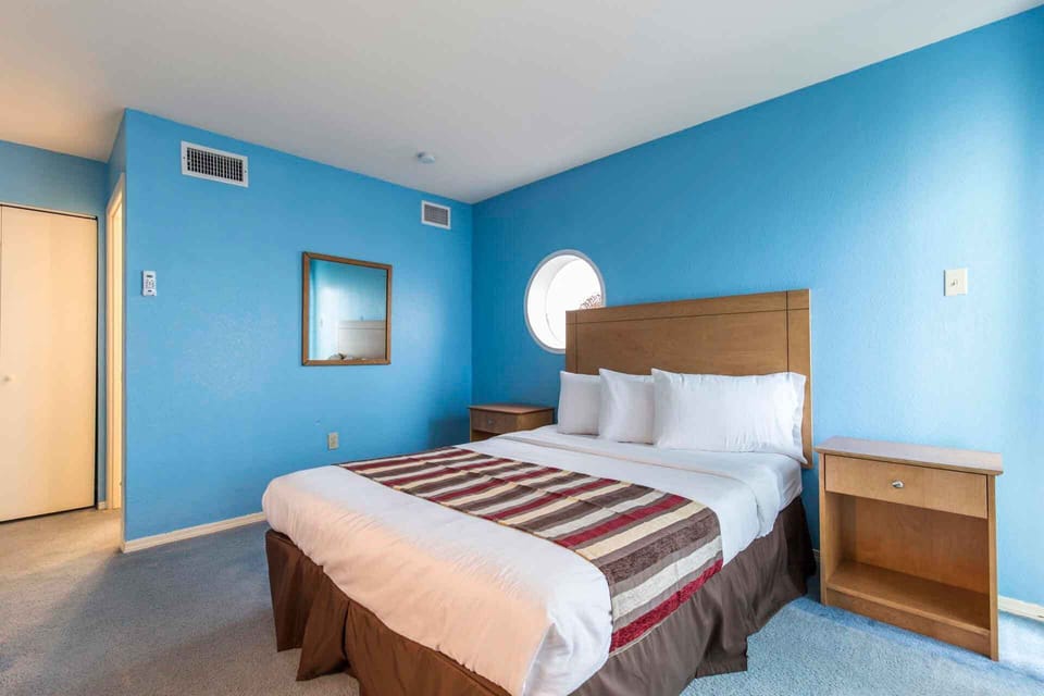 Our upstairs guest bedroom is a low-key paradise with beachy light, fun color, and simple fixtures. Welcome!