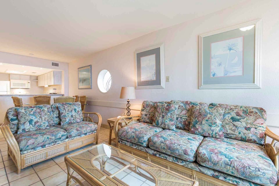 Our sweet, beachy sofa opens into a sofa sleeper for your guests.