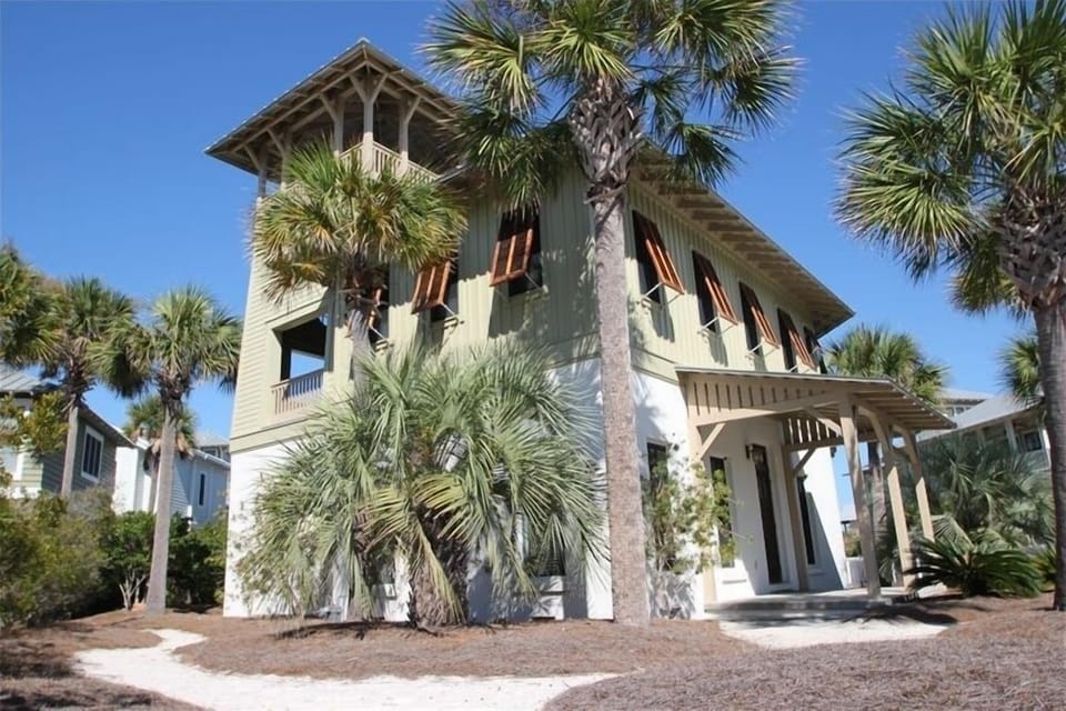 Beach cottage nestled among the palms.