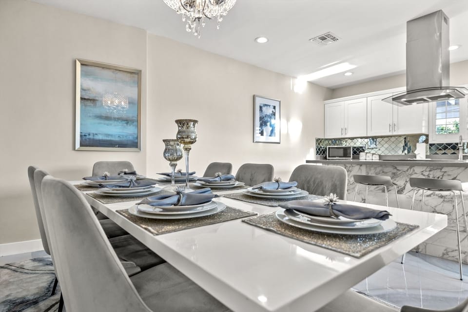 Large dining table with seating for 8 comfortably.Extra chairs available for 10.