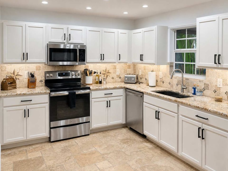 Head to the bright kitchen area fitted with everything needed to cook up a 3 course meal or just a quick snack - use the top of the line stainless steel cocker, stove, microwave, refrigerator, freezer and of course a coffee maker!