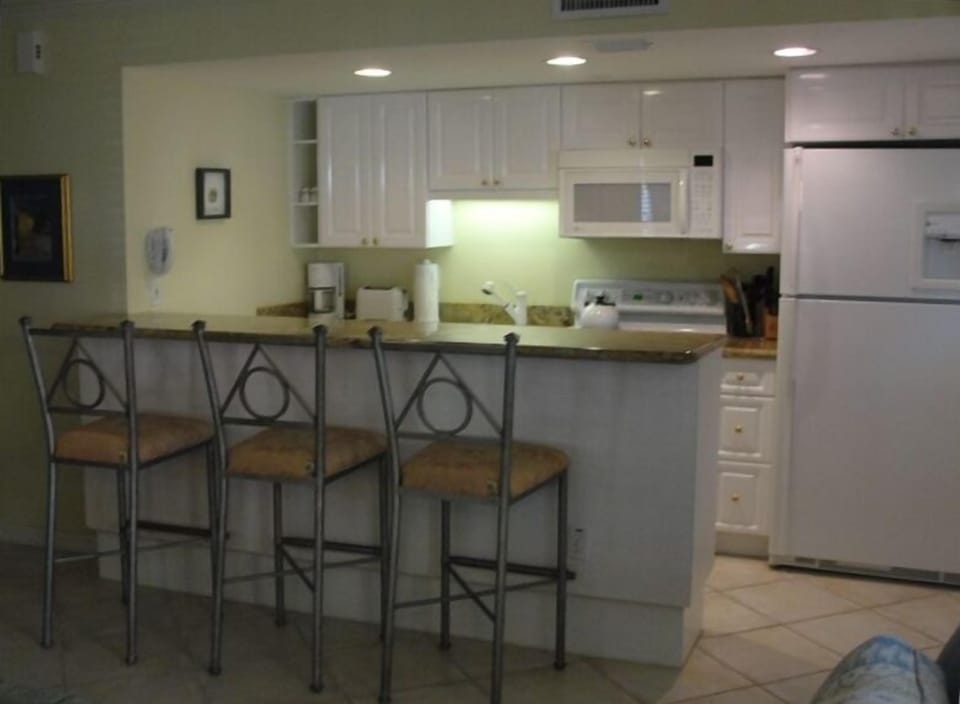 Well stocked kitchen with full-sized appliances