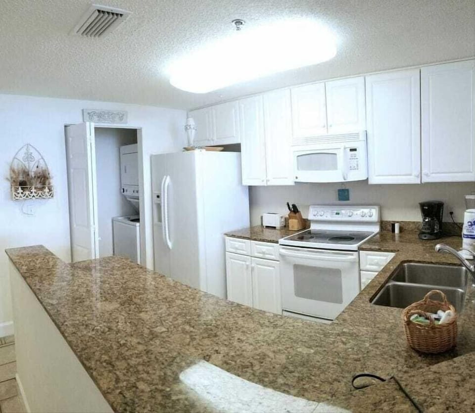 Full size washer and dryer just off kitchen