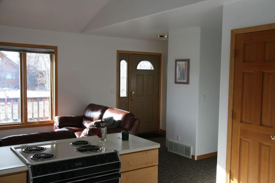 kitchen looking to entry and living room