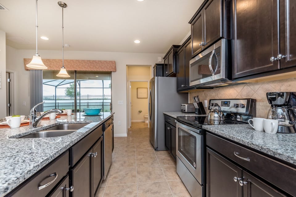 Kitchen-  A versatile hub where culinary delights and camaraderie flourish, inviting you to savor every moment in style.