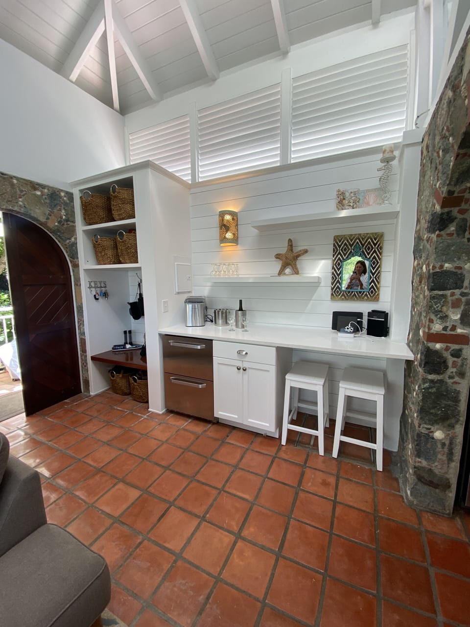 The great room has a bar area with 2-drawer refrigerator for the barkeeper!