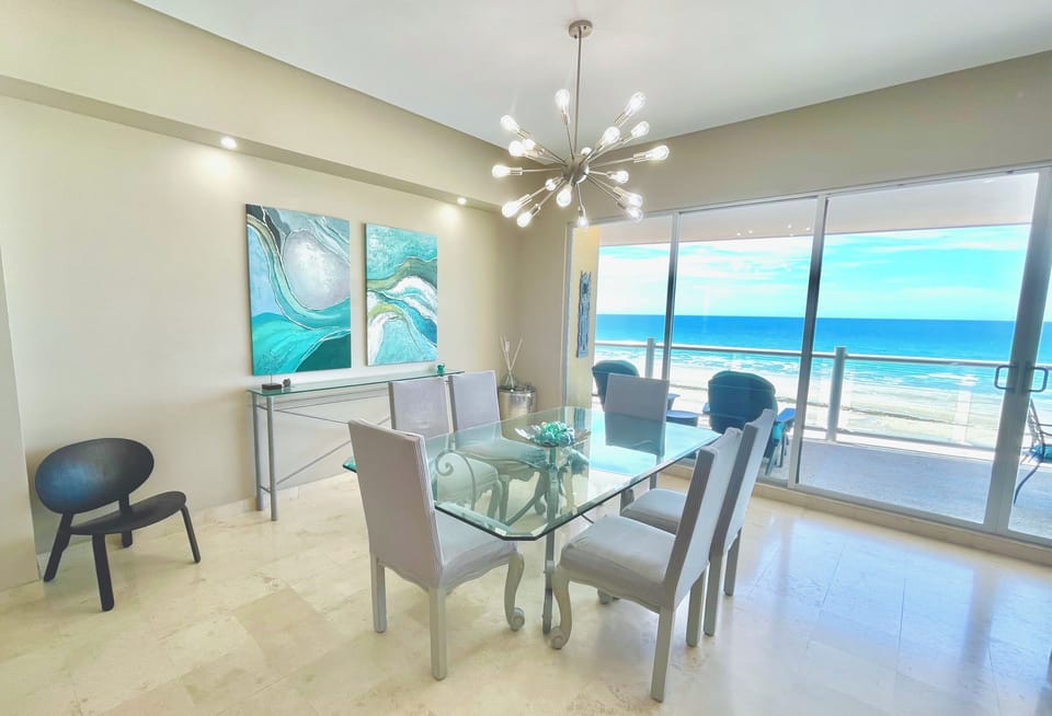 Dine with sweeping views of the beachfront.