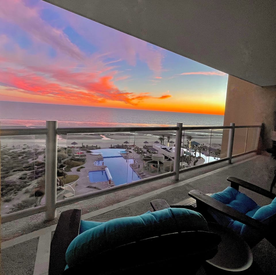 Sip your wine/margarita + watch the sunset. Whale watch w/ condo's binoculars.