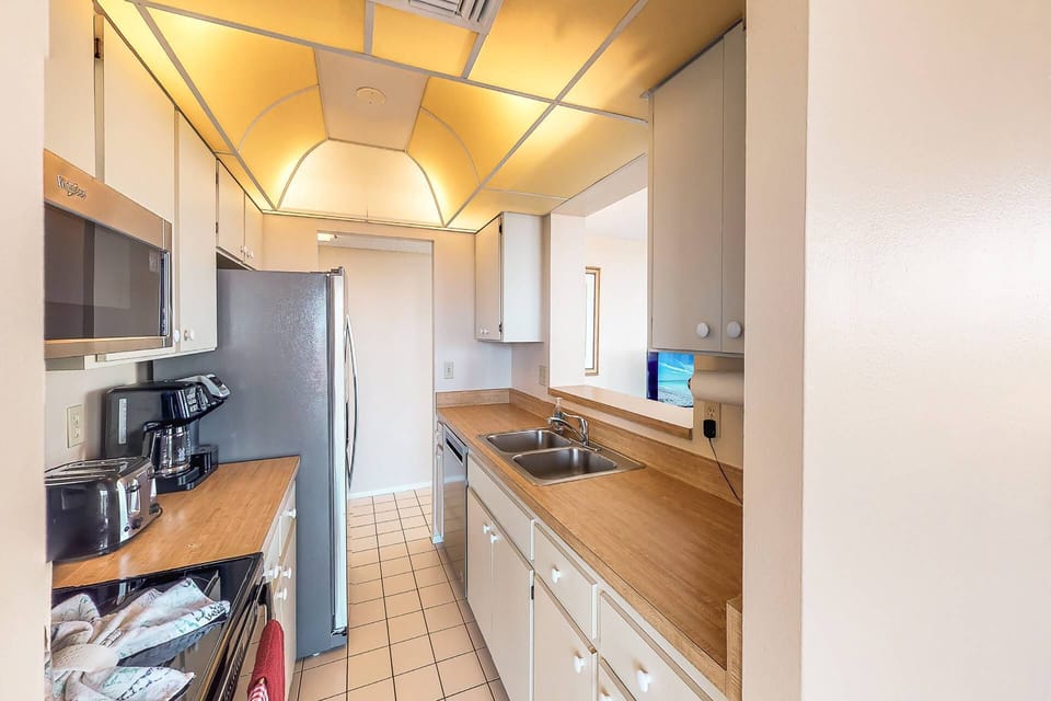 Kitchen is stocked with pots, pans, dishes and basic appliances