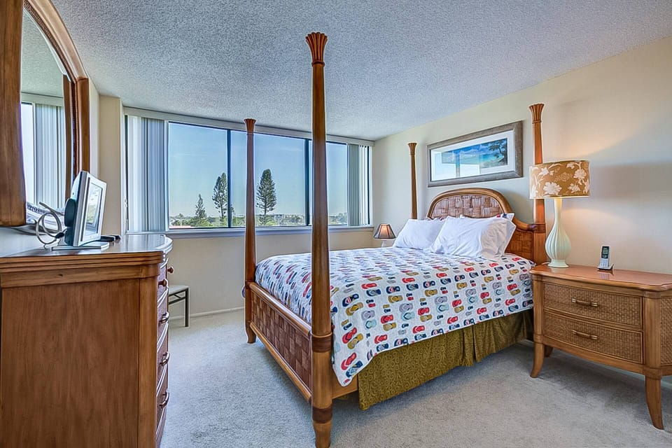 Guest bedroom with queen bed, closet and small TV.  Great views from the window.