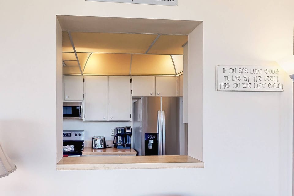 Pass thru from the kitchen to the living room allowing you to enjoy the views while busy in the kitchen