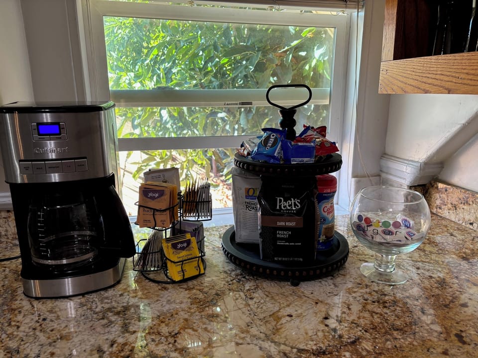 Breakfast area with Peets coffee, tea bags, sugar and cream.