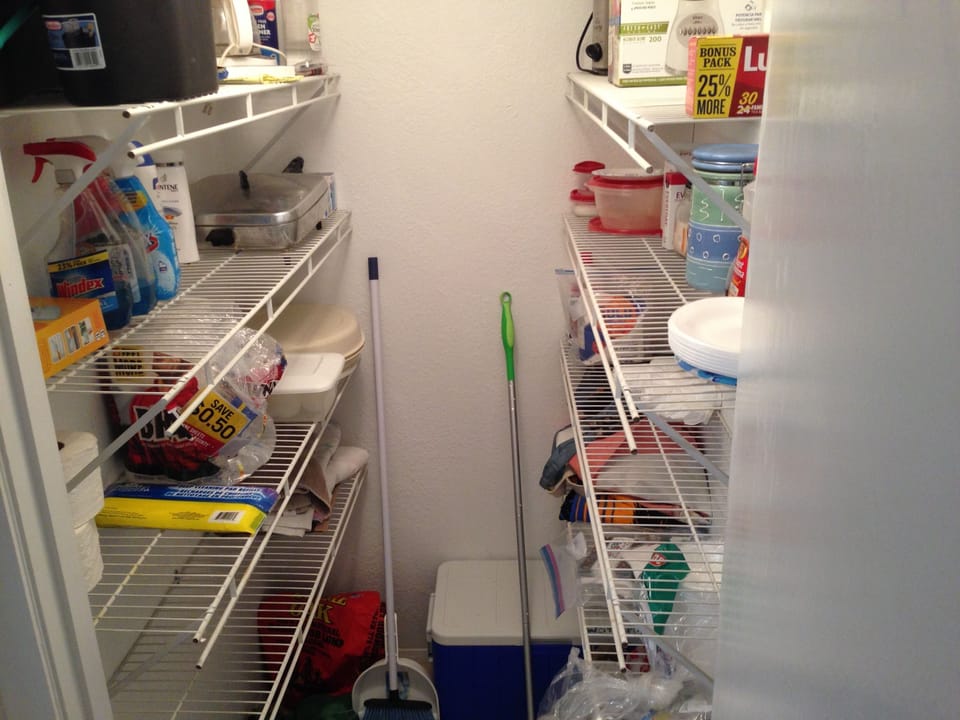 Food Pantry With Coolers and Bagged Folding Chairs